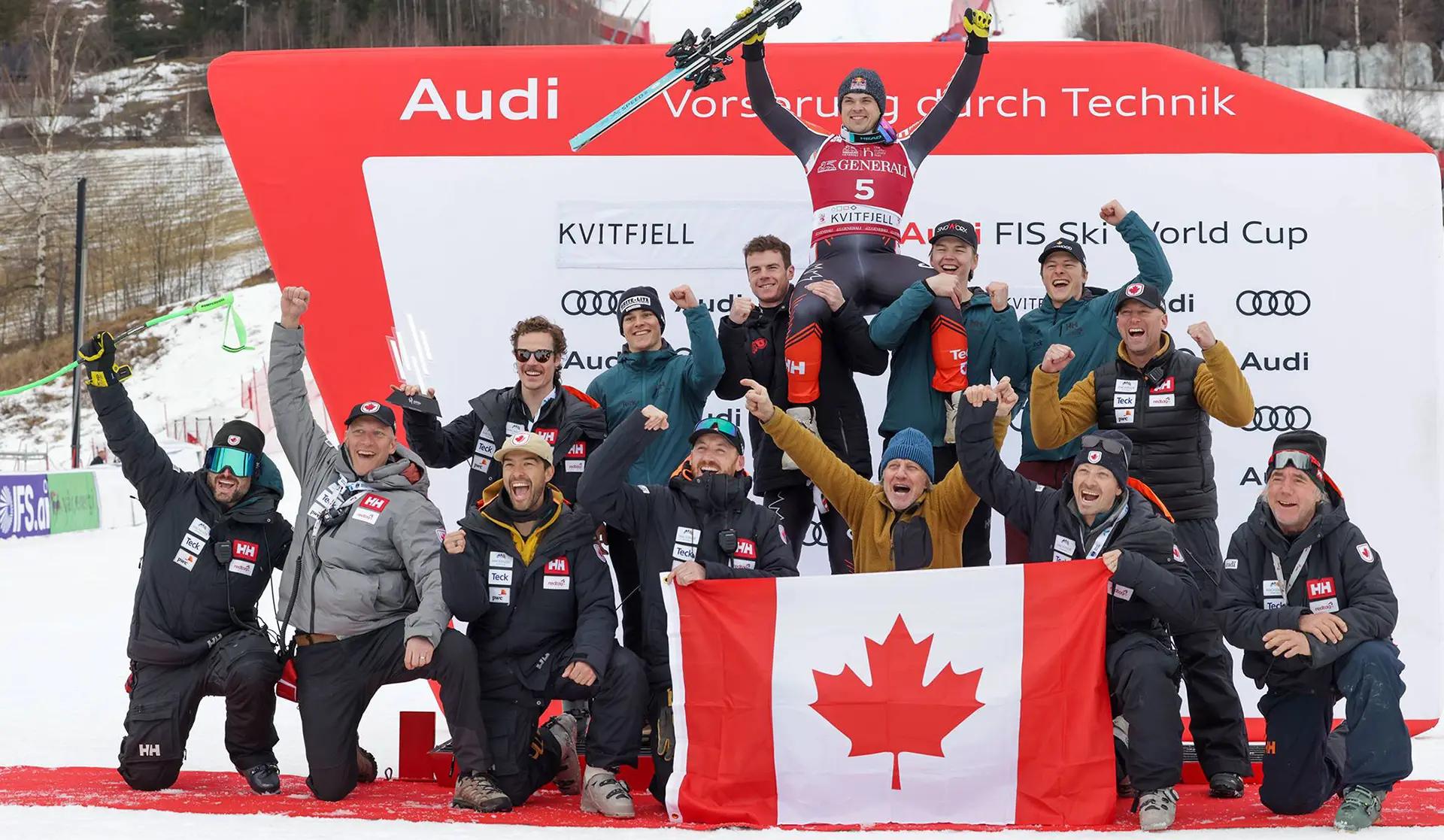 The Alpine Canada team celebrate for a photo on the podium