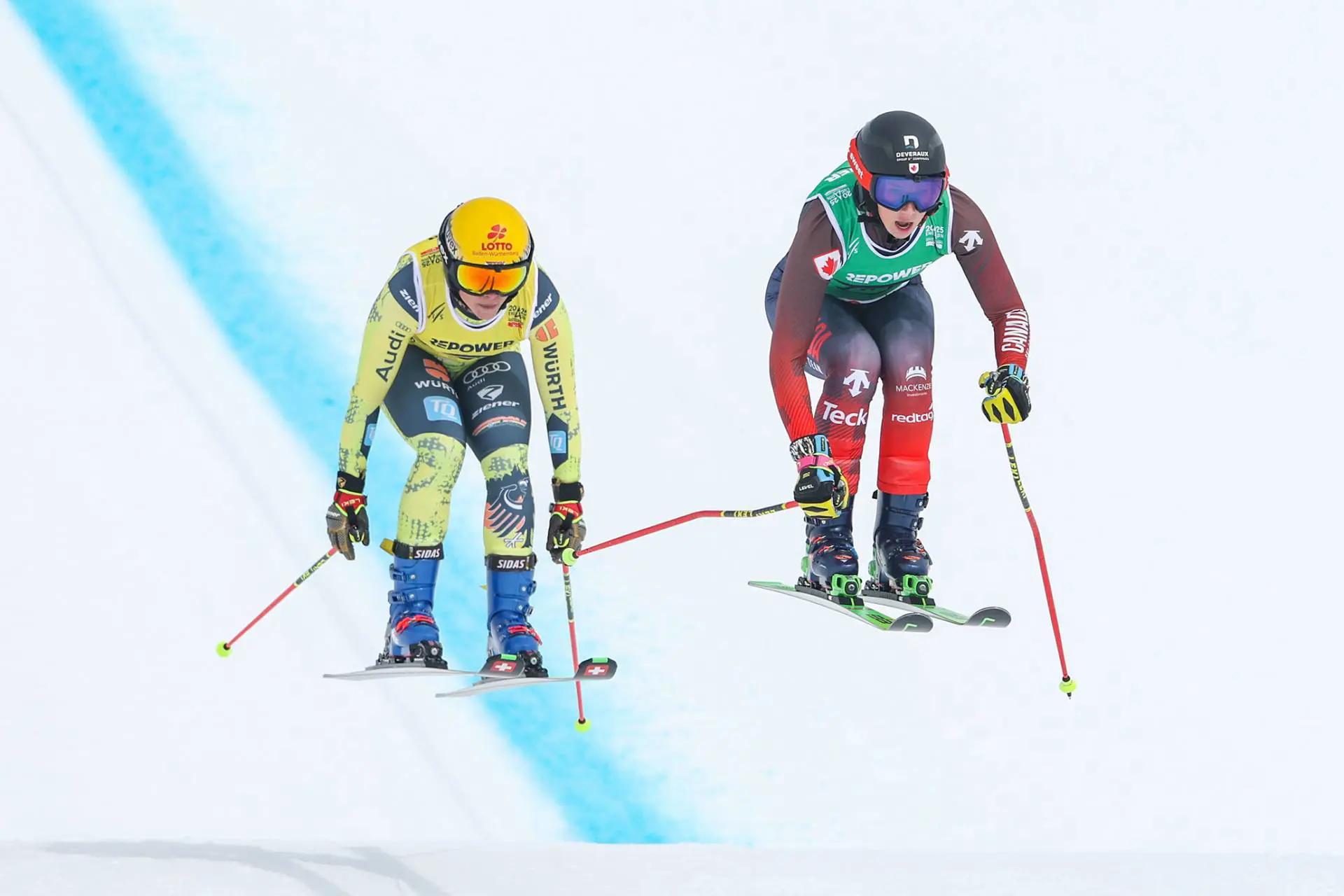 Courtney Hoffos mid air in a race with a competitor